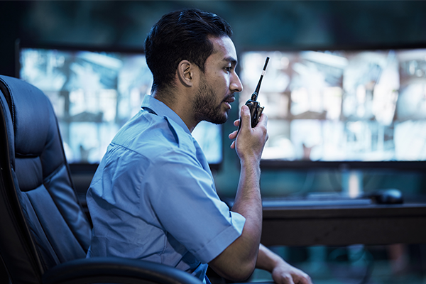 Security guard looking at CCTV footage