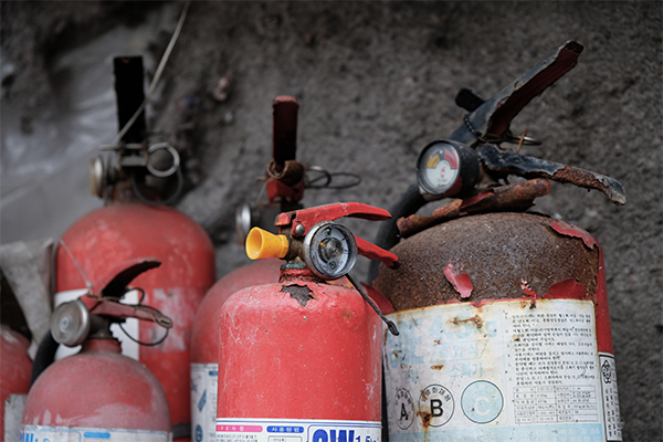Old, rusty fire extinguishers